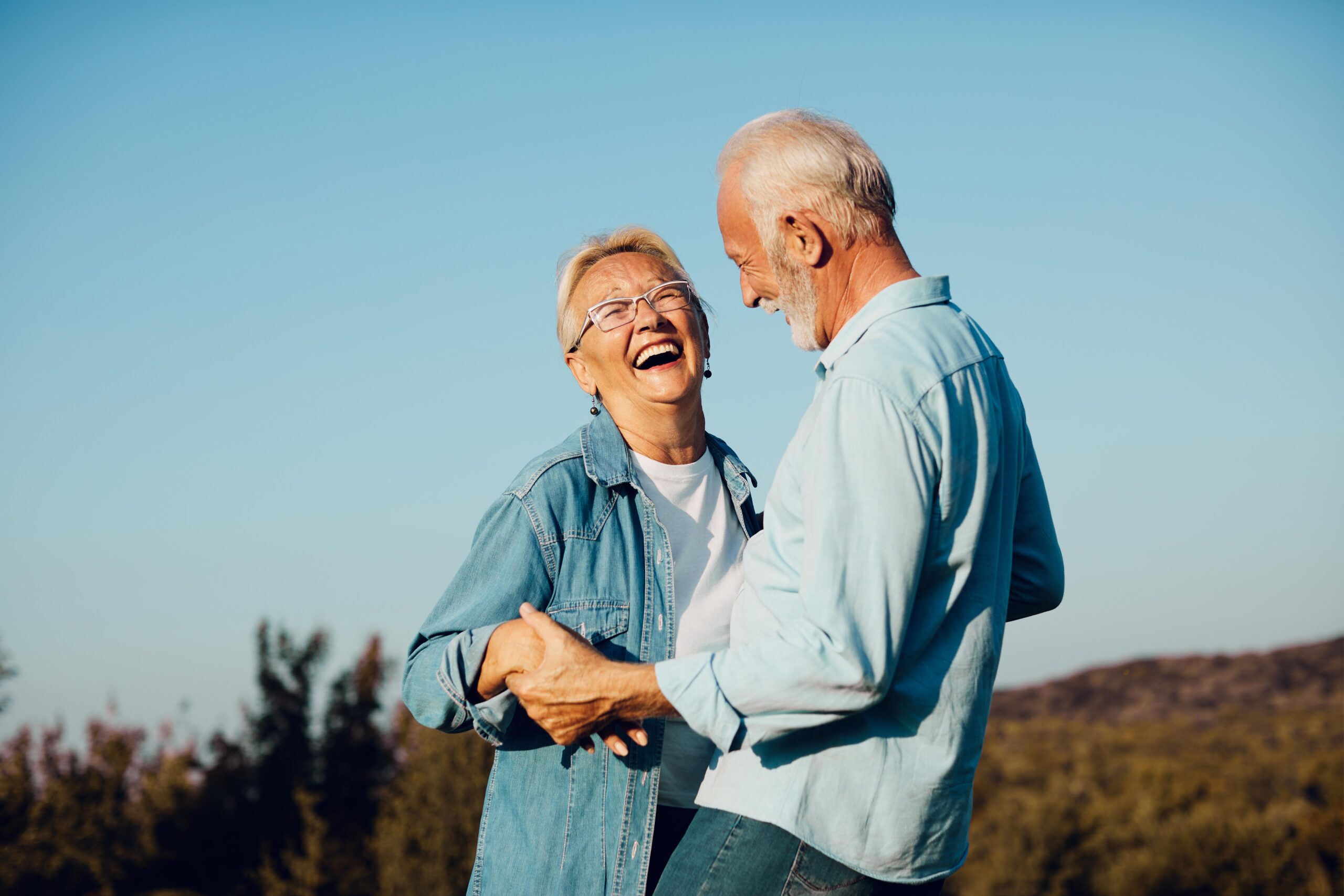 woman man outdoor senior couple happy lifestyle retirement toget - Kembla St Dental